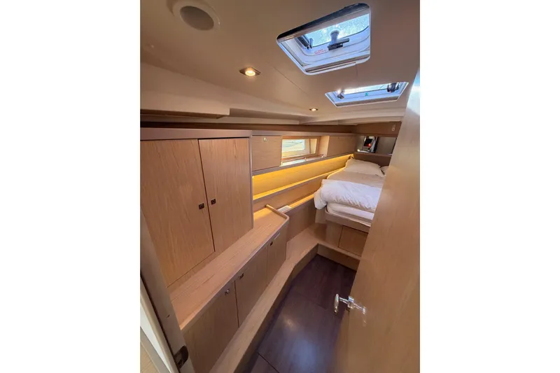 Bella Yacht Photos Pics 2017 Beneteau Oceanis 45 cabin interior with wood finish and skylight.