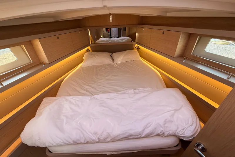 Bella Yacht Photos Pics Luxurious cabin interior of 2017 Beneteau Oceanis 45 yacht with cozy bedding.