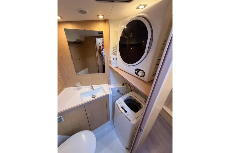 Bella Yacht Photos Pics Bathroom with washer and dryer in 2017 Beneteau Oceanis 45 yacht.