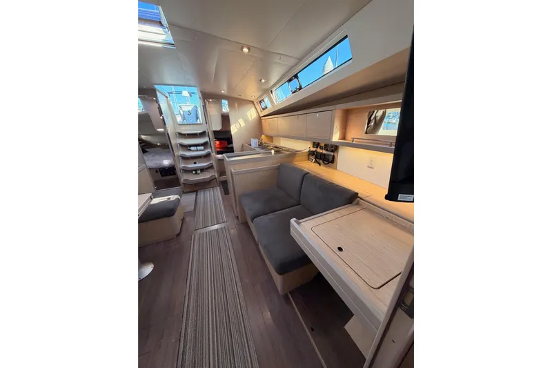 Bella Yacht Photos Pics Interior of 2017 Beneteau Oceanis 45 yacht with modern seating and sleek design.