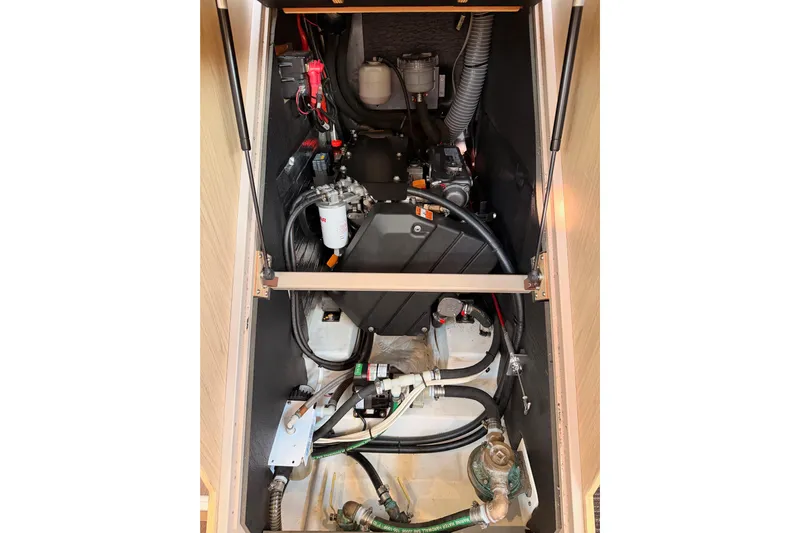 Bella Yacht Photos Pics Engine compartment of a 2017 Beneteau Oceanis 45 sailboat, showcasing mechanical components.