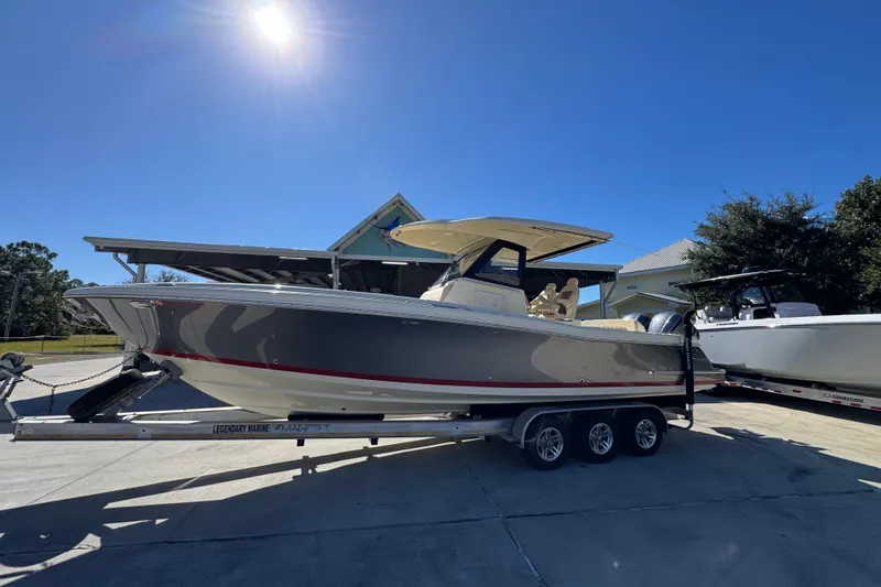 Yacht Photos Pics 2019 Chris-Craft Catalina 30 boat on trailer under clear blue sky.