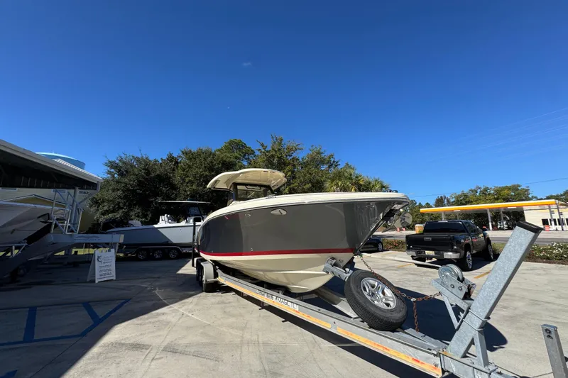  Yacht Photos Pics 2019 Chris-Craft Catalina 30 boat on trailer under clear blue sky.