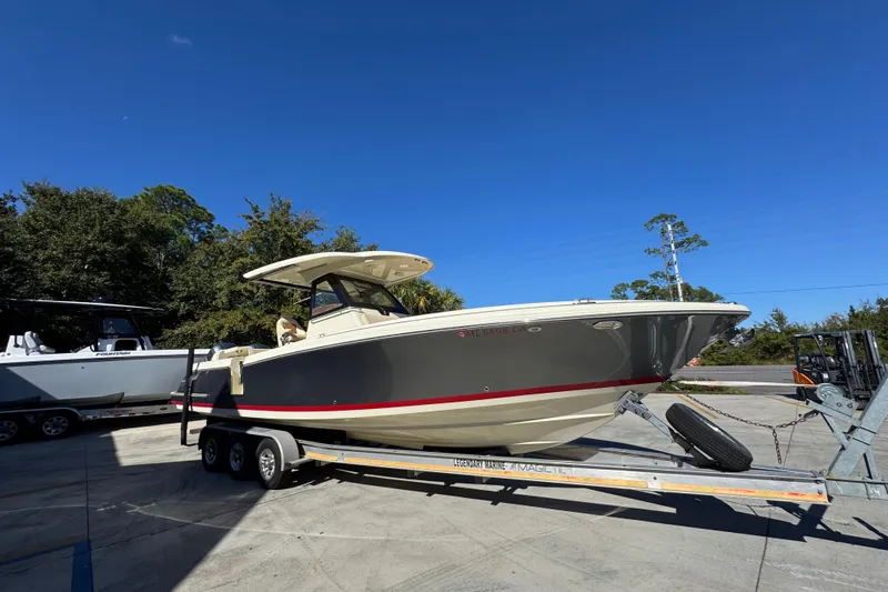  Yacht Photos Pics 2019 Chris-Craft Catalina 30 boat on trailer under clear blue sky.