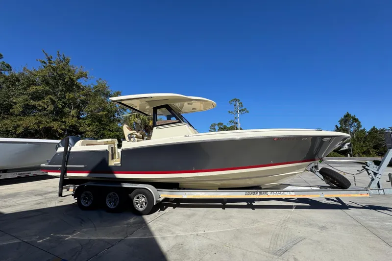  Yacht Photos Pics 2019 Chris-Craft Catalina 30 boat on trailer under clear blue sky.