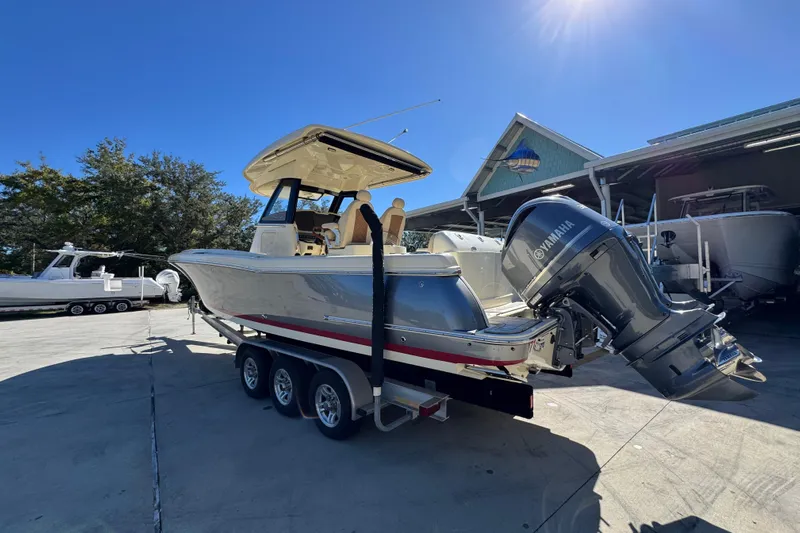  Yacht Photos Pics 2019 Chris-Craft Catalina 30 boat with Yamaha engine on trailer, sunny day.