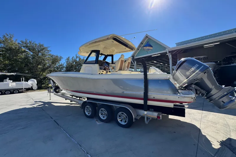  Yacht Photos Pics 2019 Chris-Craft Catalina 30 boat on trailer, featuring Yamaha outboard motor, parked outdoors.