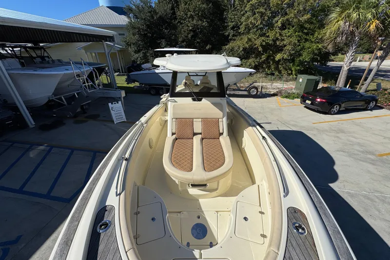  Yacht Photos Pics 2019 Chris-Craft Catalina 30 boat with elegant seating, docked outdoors.