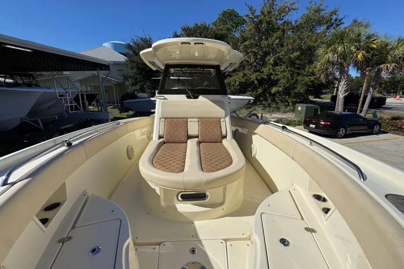  Yacht Photos Pics 2019 Chris-Craft Catalina 30 boat interior with cushioned seating and sleek design.