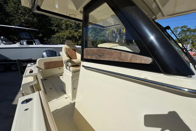  Yacht Photos Pics 2019 Chris-Craft Catalina 30 boat interior with seating and helm details.