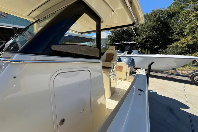  Yacht Photos Pics 2019 Chris-Craft Catalina 30 boat, side view, showcasing seating and sleek design.