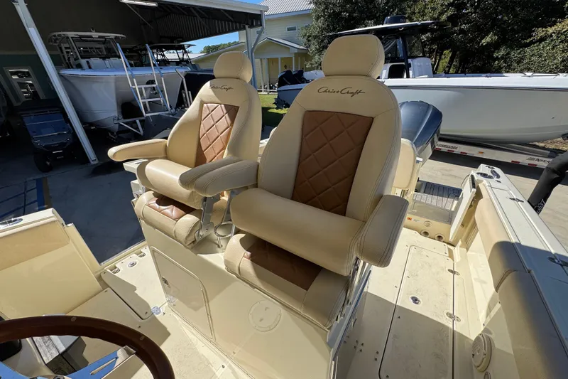  Yacht Photos Pics Luxurious seating on a 2019 Chris-Craft Catalina 30 boat, showcasing elegant design and comfort.