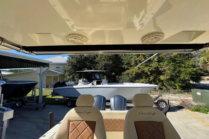  Yacht Photos Pics 2019 Chris-Craft Catalina 30 boat interior with luxurious seating and outdoor view.