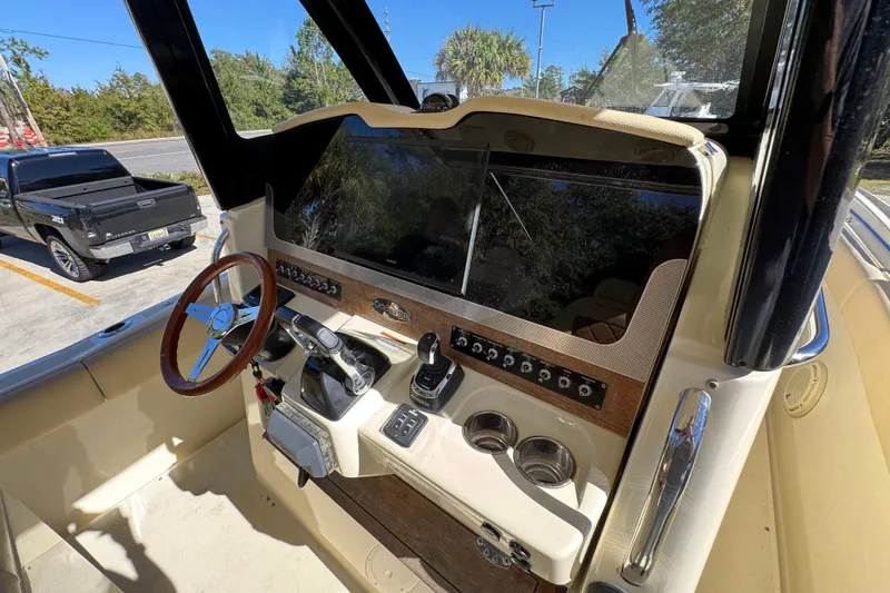  Yacht Photos Pics 2019 Chris-Craft Catalina 30 helm with steering wheel and control panel.