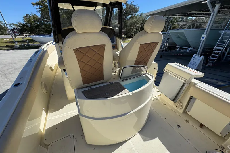  Yacht Photos Pics 2019 Chris-Craft Catalina 30 interior with seating and storage compartments.