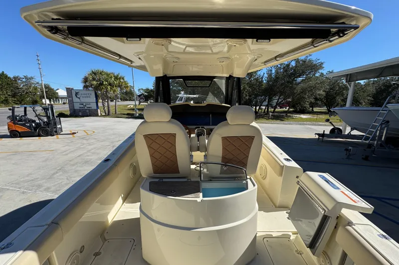  Yacht Photos Pics 2019 Chris-Craft Catalina 30 boat interior with seating and helm station.