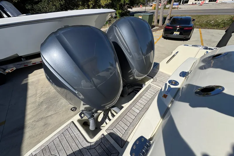  Yacht Photos Pics 2019 Chris-Craft Catalina 30 with dual outboard engines, docked on a sunny day.