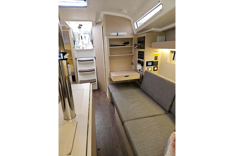 Cutting Edge Yacht Photos Pics Interior of 2023 Beneteau Oceanis 34.1 yacht, featuring modern seating and storage.