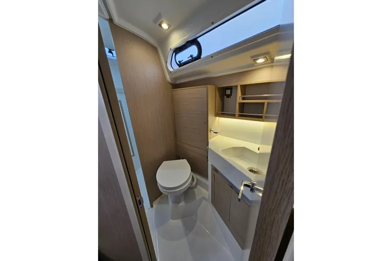 Cutting Edge Yacht Photos Pics 2023 Beneteau Oceanis 34.1 yacht bathroom with modern fixtures and wood accents.