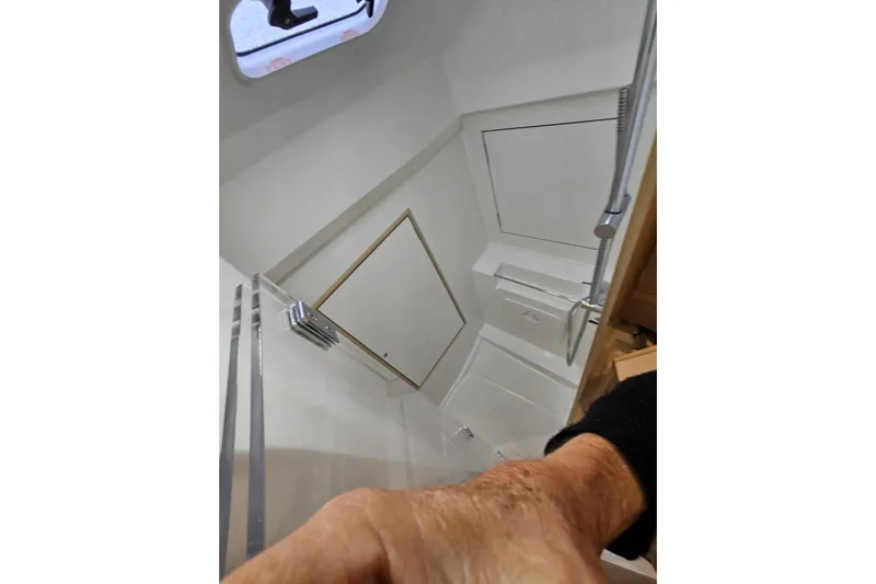 Cutting Edge Yacht Photos Pics Interior view of 2023 Beneteau Oceanis 34.1 yacht bathroom with shower.