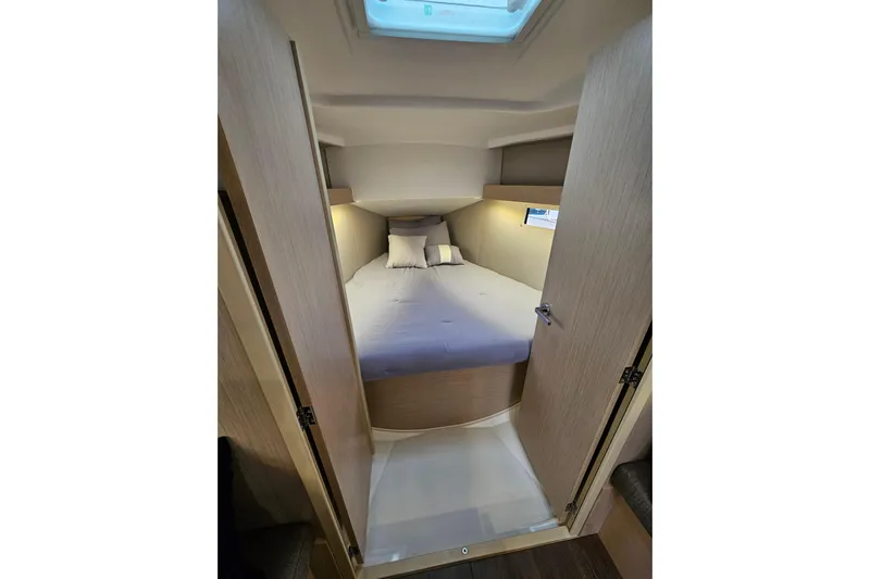 Cutting Edge Yacht Photos Pics Cozy cabin interior of 2023 Beneteau Oceanis 34.1 sailboat with comfortable bedding.