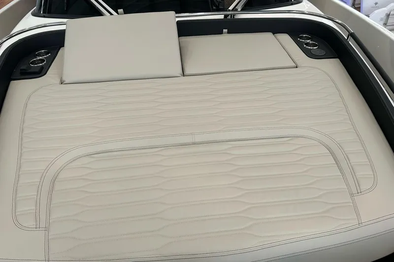  Yacht Photos Pics 2024 Cranchi A46 Luxury Tender sunbed with elegant beige upholstery and integrated cup holders.