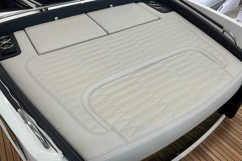  Yacht Photos Pics Luxurious sunbed on 2024 Cranchi A46 Luxury Tender yacht, featuring elegant stitching and cup holders.