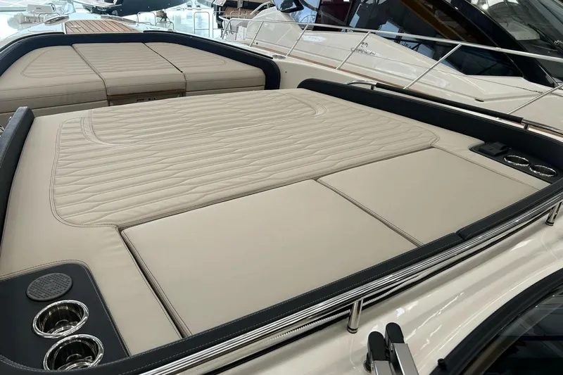  Yacht Photos Pics 2024 Cranchi A46 Luxury Tender with spacious sunbathing area and cup holders.