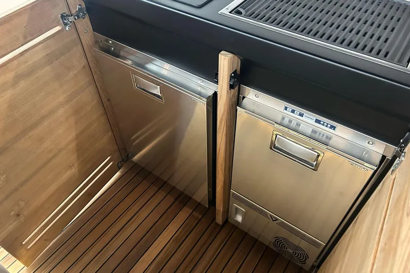  Yacht Photos Pics Stainless steel appliances in 2024 Cranchi A46 Luxury Tender's wooden interior.