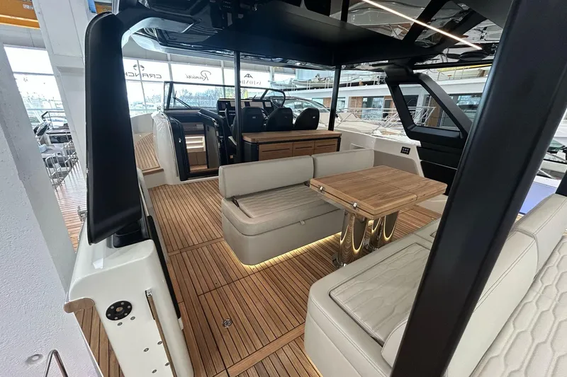  Yacht Photos Pics 2024 Cranchi A46 Luxury Tender interior with elegant seating and wooden flooring.