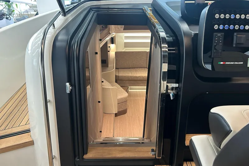  Yacht Photos Pics Interior view of 2024 Cranchi A46 Luxury Tender, showcasing modern design and seating area.