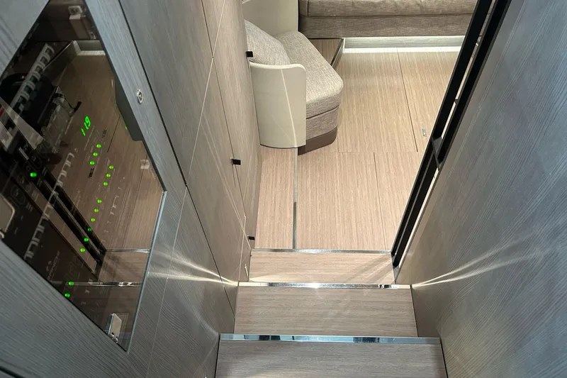  Yacht Photos Pics 2024 Cranchi A46 Luxury Tender interior with modern wood finish and seating area.