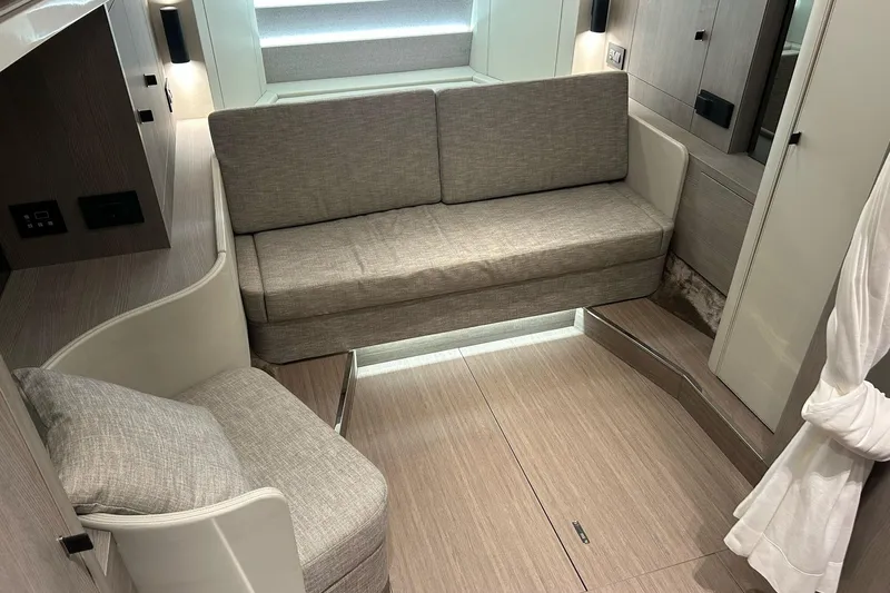  Yacht Photos Pics Interior of 2024 Cranchi A46 Luxury Tender with modern seating and wood finish.