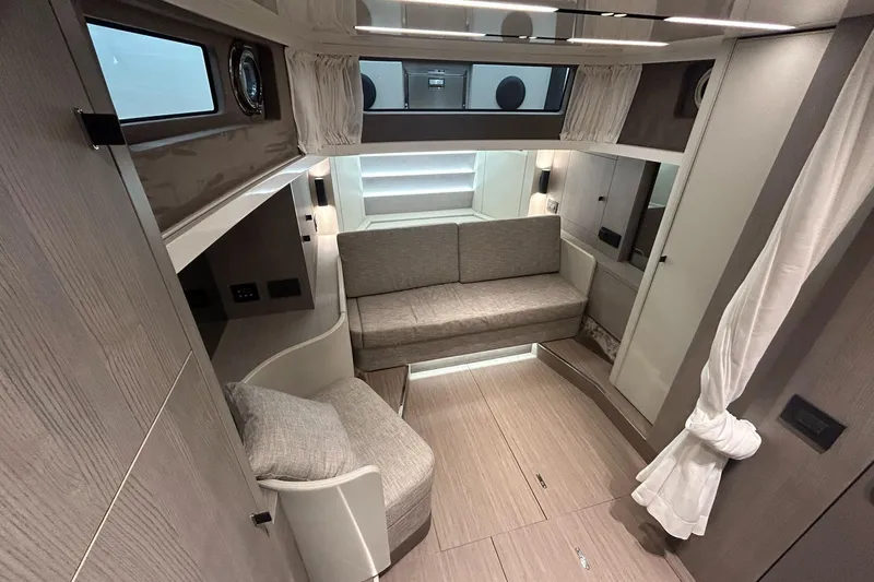  Yacht Photos Pics Luxurious interior of 2024 Cranchi A46 Luxury Tender with modern seating and elegant design.