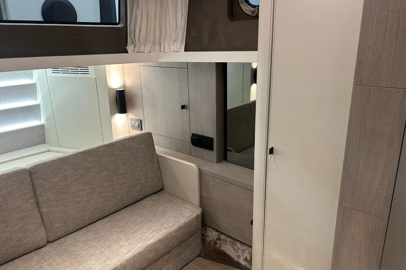  Yacht Photos Pics Interior of 2024 Cranchi A46 Luxury Tender, featuring modern seating and elegant wood finishes.