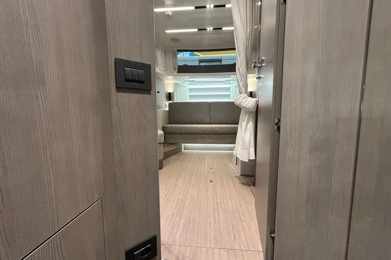  Yacht Photos Pics Interior of 2024 Cranchi A46 Luxury Tender, featuring modern design and cozy seating area.