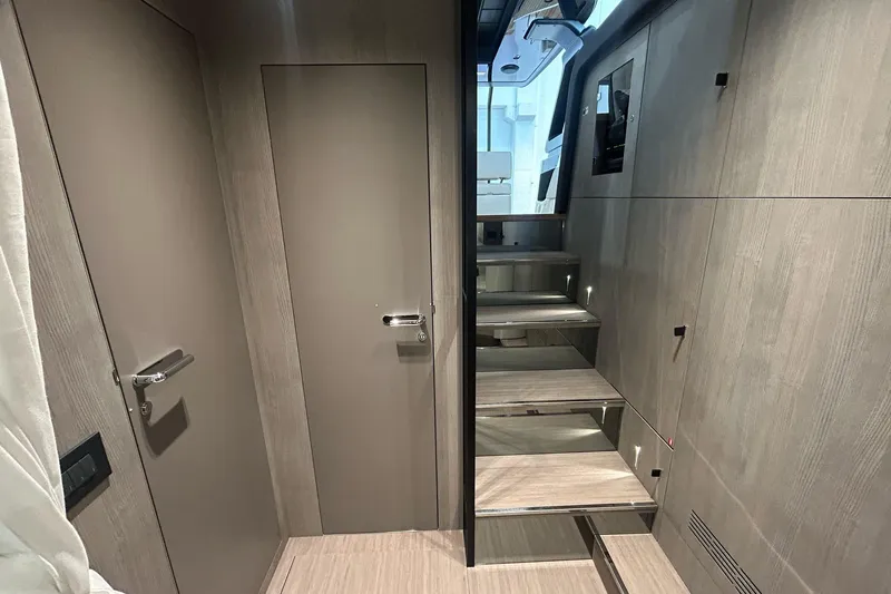  Yacht Photos Pics Interior of 2024 Cranchi A46 Luxury Tender with modern wood paneling and sleek design.