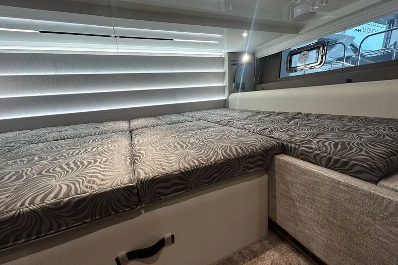  Yacht Photos Pics 2024 Cranchi A46 Luxury Tender interior with patterned bedding and modern design.