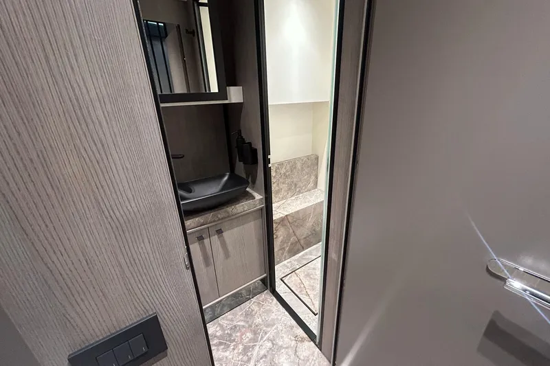  Yacht Photos Pics Luxurious bathroom interior of 2024 Cranchi A46 Luxury Tender yacht.