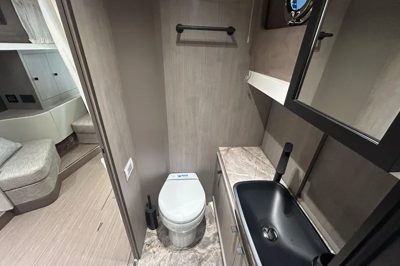  Yacht Photos Pics 2024 Cranchi A46 Luxury Tender bathroom with modern fixtures and sleek design.