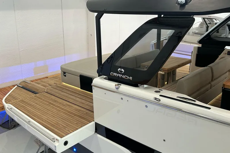  Yacht Photos Pics 2024 Cranchi A46 Luxury Tender with sleek design and wooden deck details.