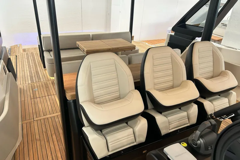  Yacht Photos Pics 2024 Cranchi A46 Luxury Tender interior with plush seating and elegant wood flooring.