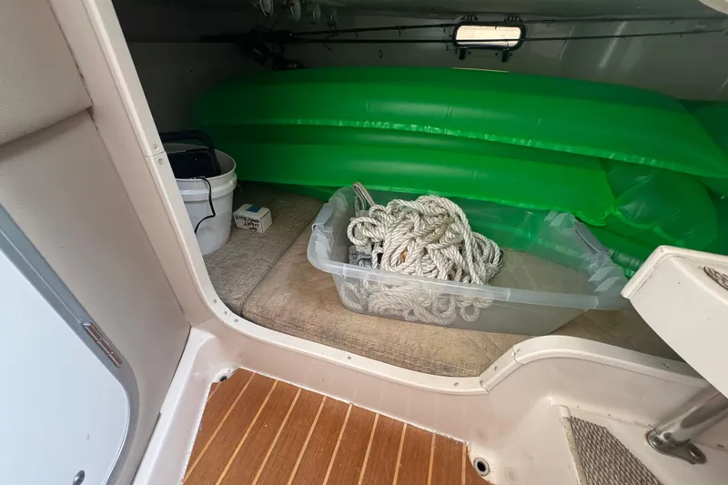  Yacht Photos Pics Interior of 2007 Grady-White Marlin 300 with rope, bucket, and green inflatable.