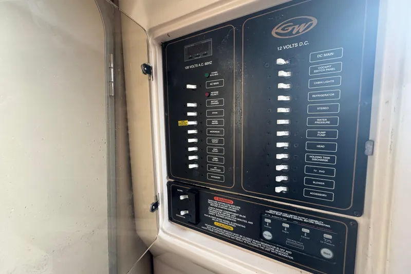  Yacht Photos Pics Electrical panel of a 2007 Grady-White Marlin 300 boat, showing switches and controls.