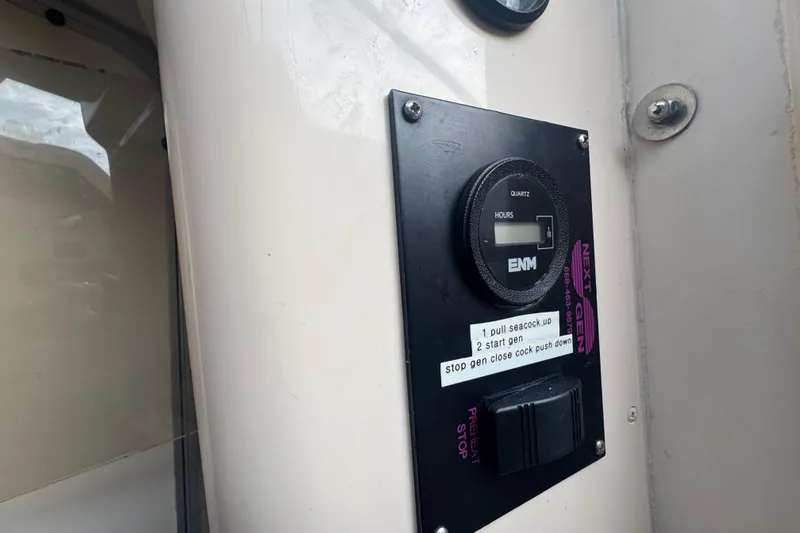  Yacht Photos Pics Control panel on a 2007 Grady-White Marlin 300 boat with instructions and hour meter.