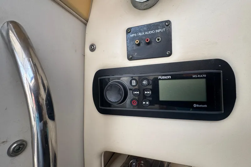  Yacht Photos Pics Audio system controls on a 2007 Grady-White Marlin 300 boat dashboard.