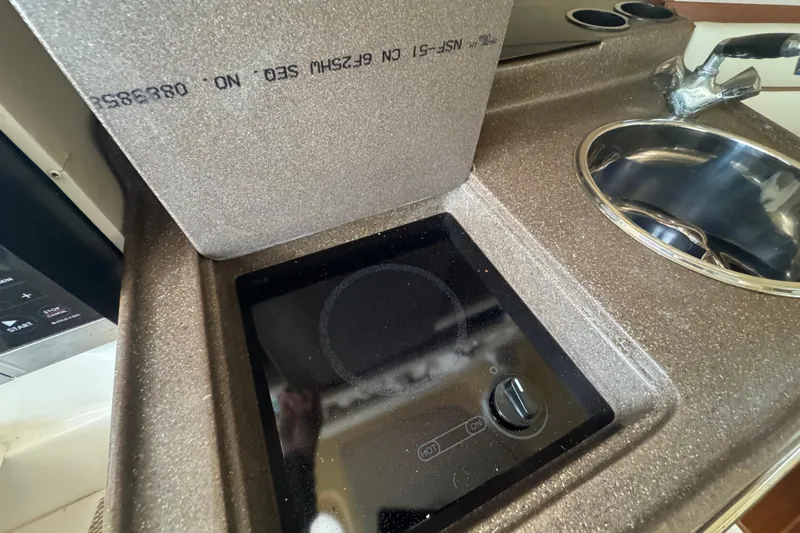  Yacht Photos Pics 2007 Grady-White Marlin 300 boat kitchen with stove and sink.