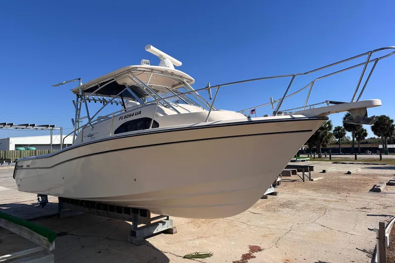  Yacht Photos Pics 2007 Grady-White Marlin 300 boat on dry dock under clear blue sky.