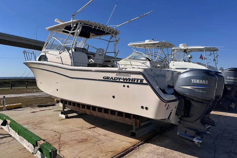  Yacht Photos Pics 2007 Grady-White Marlin 300 boat with Yamaha engines on a dock.