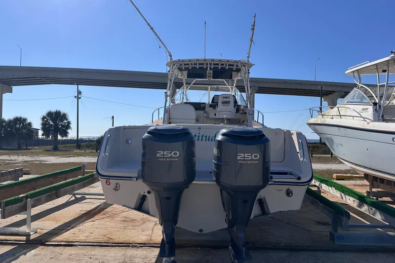  Yacht Photos Pics 2007 Grady-White Marlin 300 boat with dual 250 horsepower engines on a sunny day.
